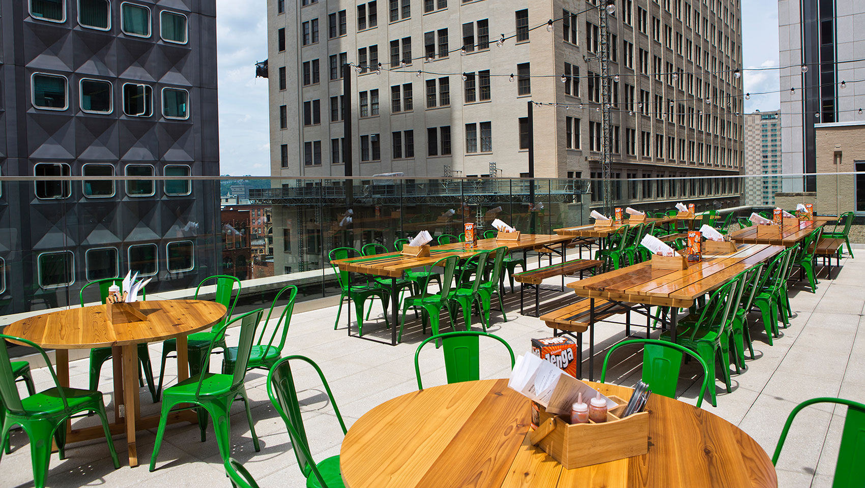 Biergarten’s rooftop patio with picnic tables and chairs