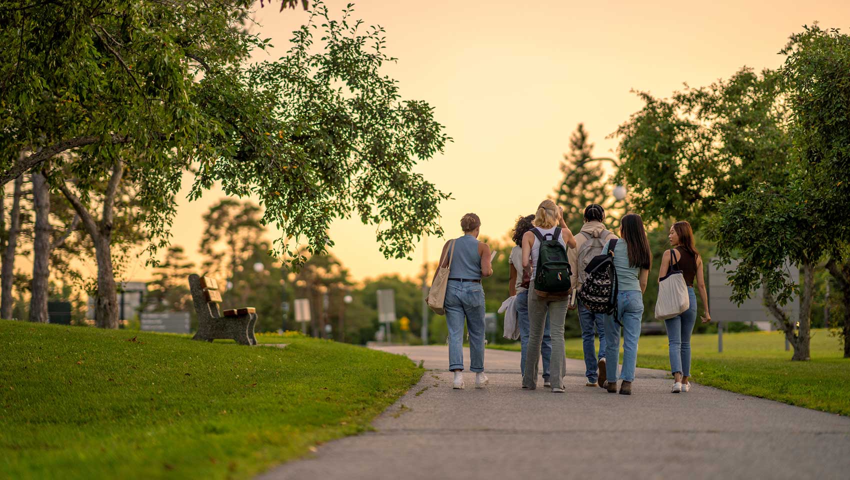 Students with backpacks walking on campus
