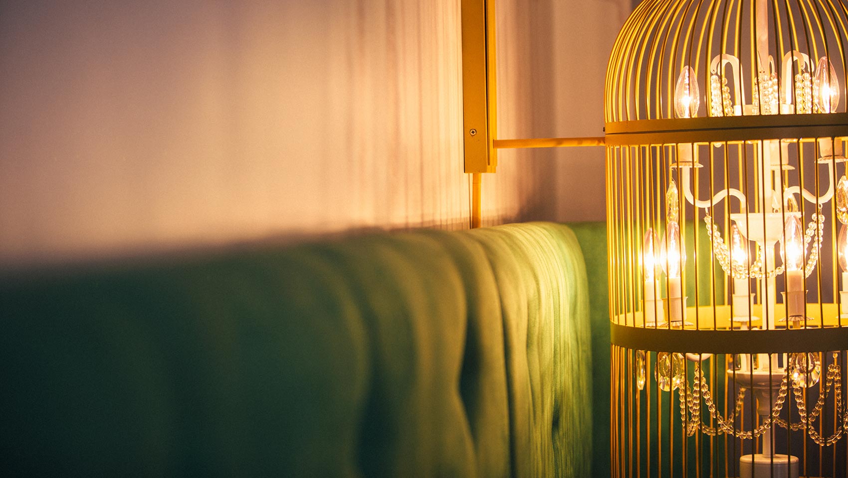 guest room headboard and chandelier