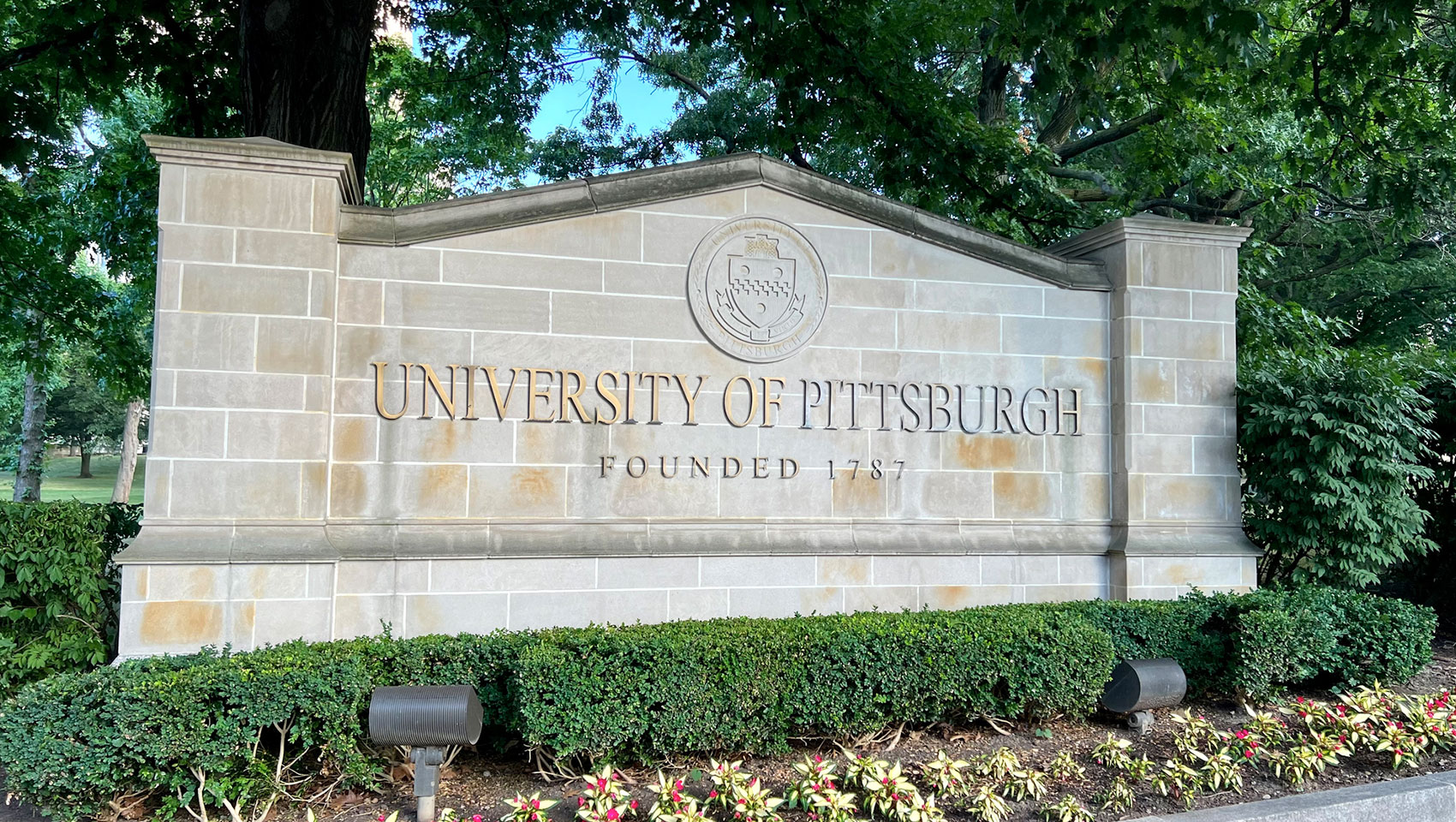 University of Pittsburgh sign on stone wall